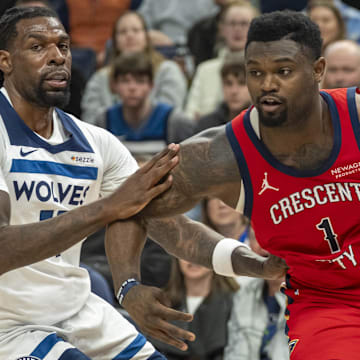 Mar 19, 2025; Minneapolis, Minnesota, USA; New Orleans Pelicans forward Zion Williamson (1) drives to the basket past Minnesota Timberwolves center Naz Reid (11) in the second half at Target Center. Mandatory Credit: Jesse Johnson-Imagn Images