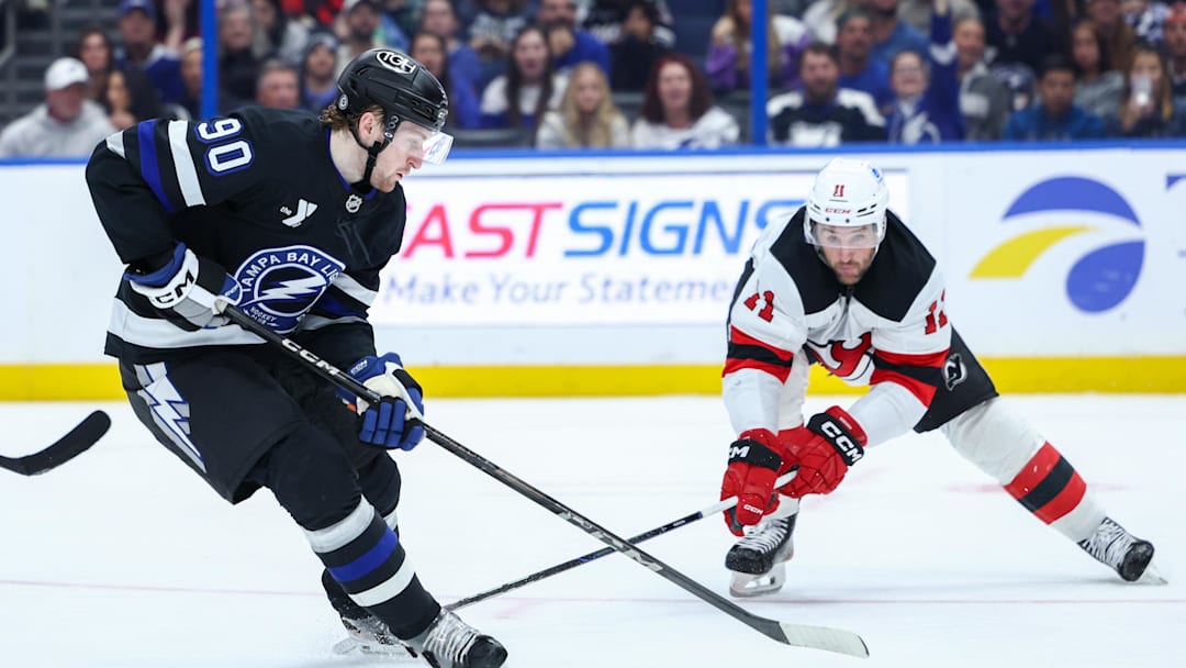 JJ Moser (#90) battling Stefan Noesen (#11) during the Lightning and Devils game
