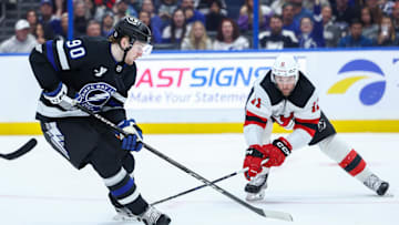 JJ Moser (#90) battling Stefan Noesen (#11) during the Lightning and Devils game
