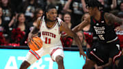 Feb 24, 2025; Lubbock, Texas, USA;  Houston Cougars forward Joseph Tugler (11) works the ball in front of Texas Tech Red Raiders forward JT Toppin (15) in the second half at United Supermarkets Arena. Mandatory Credit: Michael C. Johnson-Imagn Images