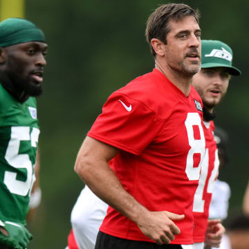 Jul 25, 2024; Florham Park, NJ, USA; New York Jets quarterback Aaron Rodgers (8) warms up during training camp at Atlantic Health Jets Training Center.