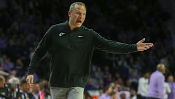 Jan 25, 2025; Manhattan, Kansas, USA; West Virginia Mountaineers head coach Darian DeVries questions a call by officials during the second half against the Kansas State Wildcats at Bramlage Coliseum. Mandatory Credit: Scott Sewell-Imagn Images