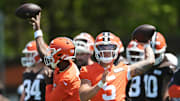 May 10, 2025; Berea, OH, USA; Cleveland Browns quarterback Dillon Gabriel (5) and quarterback Shedeur Sanders (12) throw passes during rookie minicamp at CrossCountry Mortgage Campus. Mandatory Credit: Ken Blaze-Imagn Images