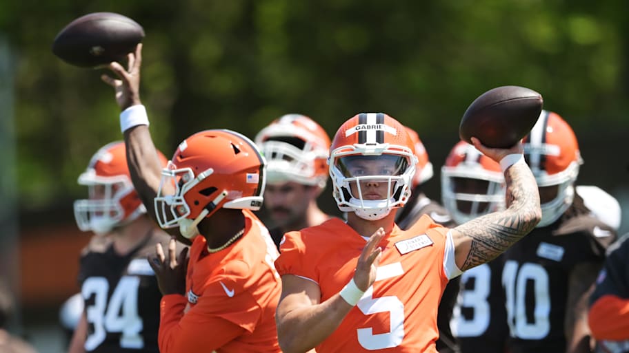 Cleveland Browns quarterback Shedeur Sanders (12) watches as quarterback Dillon Gabriel throws a pass during rookie minicamp.