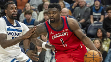Mar 19, 2025; Minneapolis, Minnesota, USA; New Orleans Pelicans forward Zion Williamson (1) drives to the basket past Minnesota Timberwolves center Naz Reid (11) in the second half at Target Center. Mandatory Credit: Jesse Johnson-Imagn Images