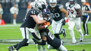 Jan 7, 2024; Paradise, Nevada, USA; Denver Broncos running back Javonte Williams (33) is tackled by