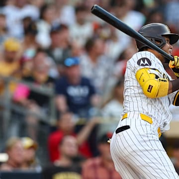 Sep 7, 2024; San Diego, California, USA; San Diego Padres designated hitter Luis Arraez (4) singles during the third inning against the San Francisco Giants at Petco Park. Mandatory Credit: Chadd Cady-Imagn Images