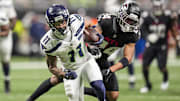 Dec 7, 2025; Atlanta, Georgia, USA; Seattle Seahawks wide receiver Jaxon Smith-Njigba (11) runs past Atlanta Falcons cornerback A.J. Terrell Jr. (24) for a touchdown during the second half at Mercedes-Benz Stadium. Mandatory Credit: Dale Zanine-Imagn Images