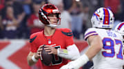 Nov 20, 2025; Houston, Texas, USA; Houston Texans quarterback Davis Mills (10) looks to pass against Buffalo Bills defensive end Joey Bosa (97) in the first quarter at NRG Stadium. Mandatory Credit: Troy Taormina-Imagn Images