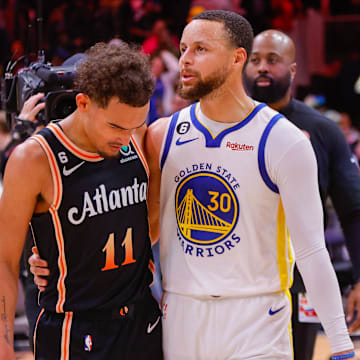 Mar 17, 2023; Atlanta, Georgia, USA; Atlanta Hawks guard Trae Young (11) talks to Golden State Warriors guard Stephen Curry (30) after a game at State Farm Arena. Mandatory Credit: Brett Davis-Imagn Images