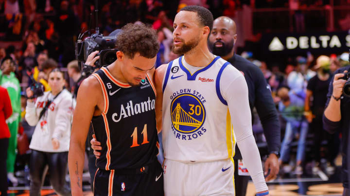 Mar 17, 2023; Atlanta, Georgia, USA; Atlanta Hawks guard Trae Young (11) talks to Golden State Warriors guard Stephen Curry (30) after a game at State Farm Arena. Mandatory Credit: Brett Davis-USA TODAY Sports