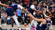 Apr 24, 2025; Inglewood, California, USA; Los Angeles Clippers guard Ben Simmons (25) is helped up by forward Derrick Jones Jr. (55) and guard Norman Powell (24) after being fouled during the first half of game three in the first round for the 2024 NBA Playoffs at Intuit Dome. Mandatory Credit: Gary A. Vasquez-Imagn Images
