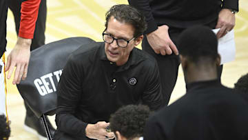 Jan 30, 2025; Cleveland, Ohio, USA; Atlanta Hawks head coach Quin Snyder talks to his team during a timeout in the fourth quarter against the Cleveland Cavaliers at Rocket Mortgage FieldHouse. Mandatory Credit: David Richard-Imagn Images
