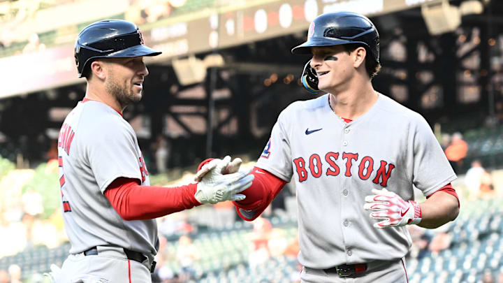Aug 27, 2025; Baltimore, Maryland, USA;  Boston Red Sox outfielder Roman Anthony (19) celebrates hitting a solo home run during the first inning with third baseman Alex Bregman (2) against the Baltimore Orioles at Oriole Park at Camden Yards. Mandatory Credit: James A. Pittman-Imagn Images