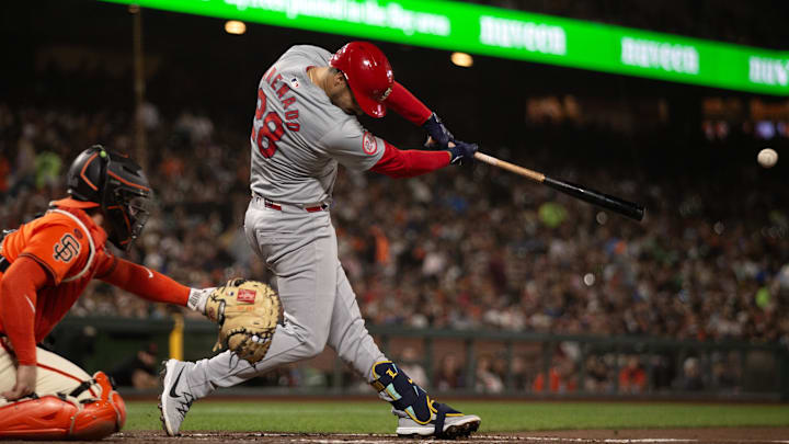 Sep 27, 2024; San Francisco, California, USA; St. Louis Cardinals third baseman Nolan Arenado (28) hits a double against the San Francisco Giants during the fourth inning at Oracle Park. 