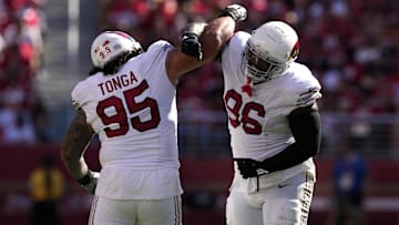 Oct 6, 2024; Santa Clara, California, USA; Arizona Cardinals defensive tackle Naquan Jones (96) celebrates with defensive tackle Khyiris Tonga (95) after recording a sack against the San Francisco 49ers during the third quarter at Levi's Stadium. Mandatory Credit: Darren Yamashita-Imagn Images