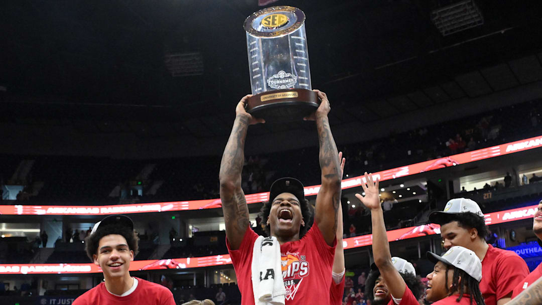 The Arkansas Razorbacks hold the trophy after the men's SEC Conference Tournament Championship against the Vanderbilt Commodores at Bridgestone Arena. Mandatory Credit: Steve Roberts-Imagn Images