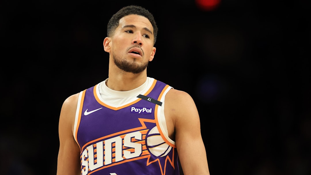 Apr 8, 2025; Phoenix, Arizona, USA; Phoenix Suns guard Devin Booker (1) reacts against the Golden State Warriors during the second half at Footprint Center. Mandatory Credit: Mark J. Rebilas-Imagn Images