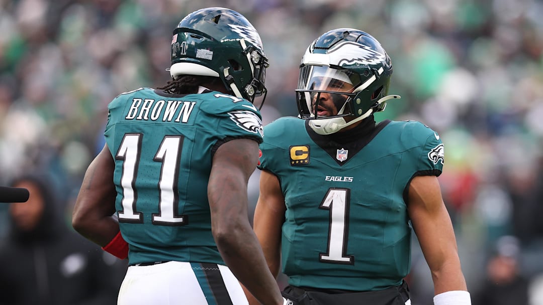 Dec 14, 2025; Philadelphia, Pennsylvania, USA; Philadelphia Eagles quarterback Jalen Hurts (1) reacts with wide receiver A.J. Brown (11) after their touchdown connection during the fourth quarter against the Las Vegas Raiders at Lincoln Financial Field. Mandatory Credit: Bill Streicher-Imagn Images
