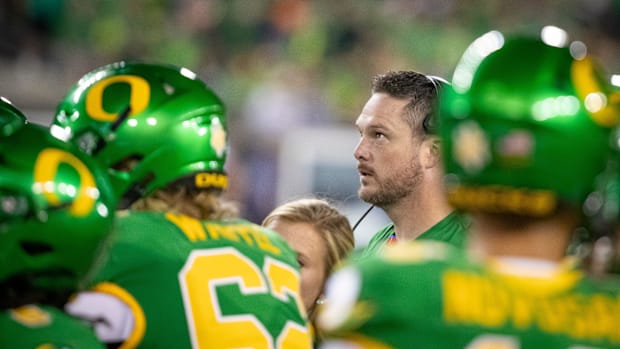 Oregon head coach Dan Lanning watches the video board as it plays a targeting review as the Oregon Ducks