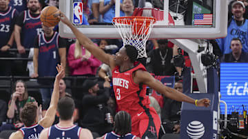 Apr 9, 2025; Inglewood, California, USA; Houston Rockets center N'Faly Dante (3) block Los Angeles Clippers guard Bogdan Bogdanovic (10) in the second half at Intuit Dome. Mandatory Credit: Kirby Lee-Imagn Images