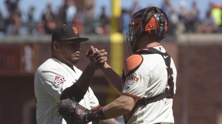 Jun 20, 2018; San Francisco, CA, USA; San Francisco Giants relief pitcher Reyes Moronta (54) and catcher Nick Hundley (5) celebrate after defeating the Miami Marlins at AT&T Park. Mandatory Credit: Ed Szczepanski-USA TODAY Sports