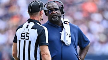 New Patriots defensive coordinator Terrell Williams talks with Line Judge Daniel Gallagher (85) at Soldier Field.