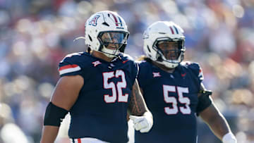 Nov 8, 2025; Tucson, Arizona, USA; Arizona Wildcats offensive lineman Ka'ena Decambra (52) and Chubba Maae (55) against the Kansas Jayhawks at Arizona Stadium. Mandatory Credit: Mark J. Rebilas-Imagn Images