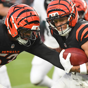 Aug 7, 2025; Philadelphia, Pennsylvania, USA; Cincinnati Bengals wide receiver Jermaine Burton (81) is tackled by Philadelphia Eagles tight end Cameron Latu (49) during the first quarter at Lincoln Financial Field. Mandatory Credit: Eric Hartline-Imagn Images