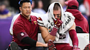 Dec 7, 2025; Minneapolis, Minnesota, USA; Washington Commanders tight end Zach Ertz (86) is carted off the field after an injury during the second half at U.S. Bank Stadium.