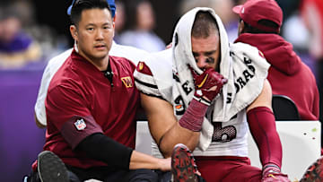 Dec 7, 2025; Minneapolis, Minnesota, USA; Washington Commanders tight end Zach Ertz (86) is carted off the field after an injury during the second half at U.S. Bank Stadium.