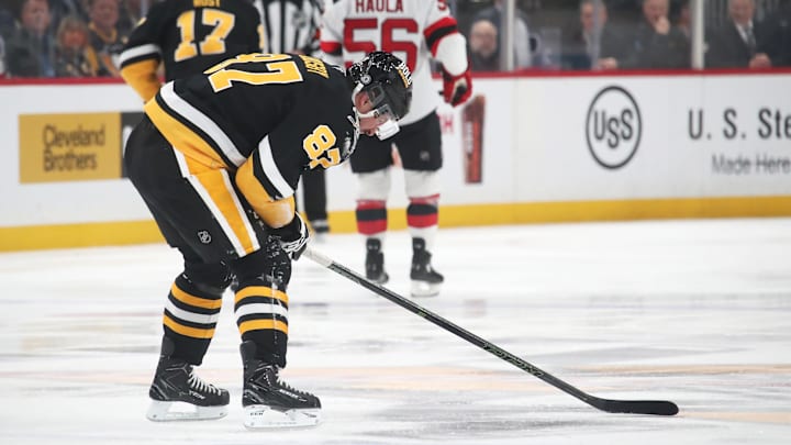 Feb 4, 2025; Pittsburgh, Pennsylvania, USA;  Pittsburgh Penguins center Sidney Crosby (87) reacts after suffering an apparent injury against the New Jersey Devils during the third period Crosby would return later in the period. at PPG Paints Arena. Mandatory Credit: Charles LeClaire-Imagn Images