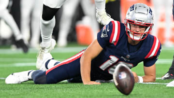 Aug 15, 2024; Foxborough, Massachusetts, USA; New England Patriots quarterback Drake Maye (10) fumbles the ball against the Philadelphia Eagles during the second half at Gillette Stadium. Mandatory Credit: Brian Fluharty-USA TODAY Sports