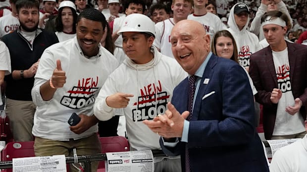 Dick Vitale poses with members of the Alabama student section earlier this yea