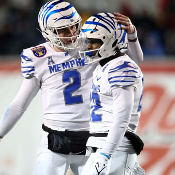 Dec 29, 2023; Memphis, TN, USA; Memphis Tigers quarterback Seth Henigan (2) reacts with Memphis Tigers running back Brandon Thomas (22) during the second half  against the Iowa State Cyclones at Simmons Bank Liberty Stadium. Mandatory Credit: Petre Thomas-USA TODAY Sports