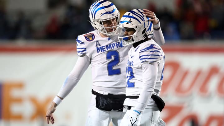 Dec 29, 2023; Memphis, TN, USA; Memphis Tigers quarterback Seth Henigan (2) reacts with Memphis Tigers running back Brandon Thomas (22) during the second half  against the Iowa State Cyclones at Simmons Bank Liberty Stadium. Mandatory Credit: Petre Thomas-USA TODAY Sports