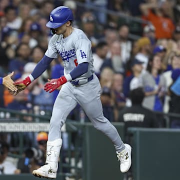 Jul 27, 2024; Houston, Texas, USA; Los Angeles Dodgers first baseman Cavan Biggio (6) celebrates with third base coach Dino Ebel (91) after hitting a home run during the eighth inning against the Houston Astros at Minute Maid Park.