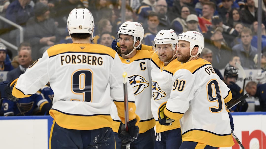 Dec 27, 2024; St. Louis, Missouri, USA; Nashville Predators center Steven Stamkos (91) is congratulated by teammates after scoring a goal against the St. Louis Blues during the first period at Enterprise Center. Mandatory Credit: Jeff Le-Imagn Images