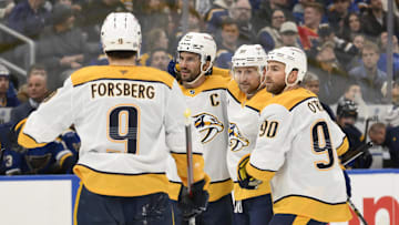 Dec 27, 2024; St. Louis, Missouri, USA; Nashville Predators center Steven Stamkos (91) is congratulated by teammates after scoring a goal against the St. Louis Blues during the first period at Enterprise Center. Mandatory Credit: Jeff Le-Imagn Images