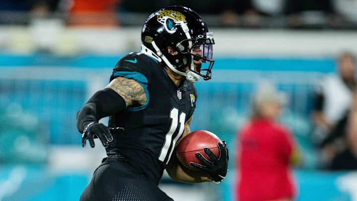Dec 4, 2023; Jacksonville, Florida, USA; Jacksonville Jaguars wide receiver Parker Washington (11) returns the kick against the Cincinnati Bengals in the third quarter at EverBank Stadium. Mandatory Credit: Jeremy Reper-Imagn Images Dec 4, 2023; Jacksonville, Florida, USA; Jacksonville Jaguars wide receiver Parker Washington (11) returns the kick against the Cincinnati Bengals in the third quarter at EverBank Stadium. Mandatory Credit: Jeremy Reper-Imagn Images