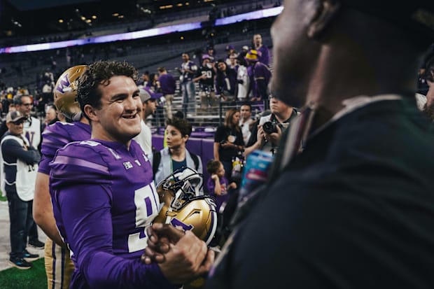 UW kicker Grady Gross exchanges handshakes with a well-wisher. 