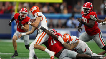 Aug 31, 2024; Atlanta, Georgia, USA; Clemson Tigers quarterback Cade Klubnik (2) is tackled by Georgia Bulldogs linebacker Jalon Walker (11) in the third quarter at Mercedes-Benz Stadium. Mandatory Credit: Brett Davis-USA TODAY Sports