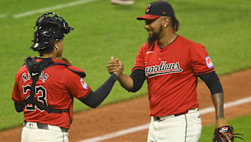Sep 24, 2024; Cleveland, Ohio, USA; Cleveland Guardians catcher Bo Naylor (23) and relief pitcher Emmanuel Clase (48) celebrate a win over the Cincinnati Reds at Progressive Field.