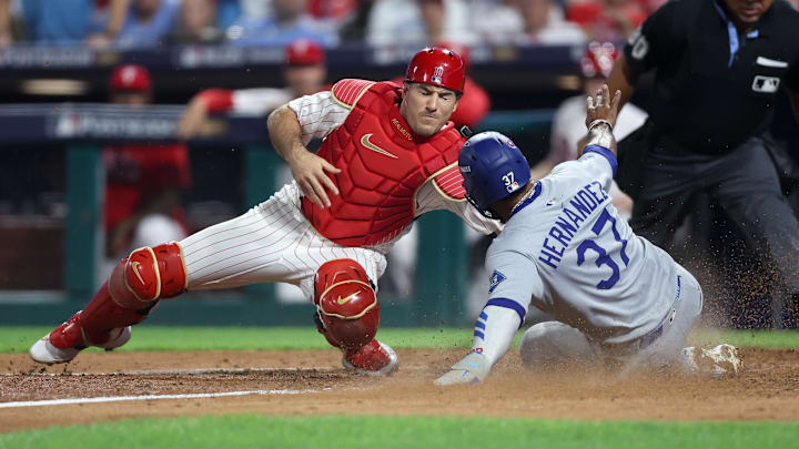 J.T. Realmuto, left, has yet to re-sign with the Phillies despite their reunion seeming like a foregone conclusion.