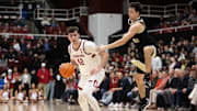 Feb 5, 2025; Stanford, California, USA; Wake Forest Demon Deacons guard Parker Friedrichsen (right) leaves his feet while guarding Stanford Cardinal forward Maxime Raynaud (42) during the first half at Maples Pavilion. Mandatory Credit: D. Ross Cameron-Imagn Images
