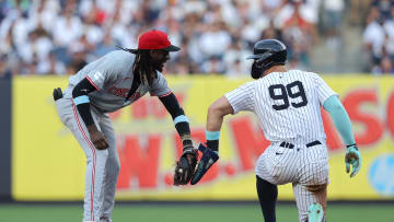 Jul 2, 2024; Bronx, New York, USA; Cincinnati Reds shortstop Elly De La Cruz (44) greets New York Yankees designated hitter Aaron Judge (99) at second base after forcing him out to end the first inning at Yankee Stadium. Mandatory Credit: Brad Penner-USA TODAY Sports