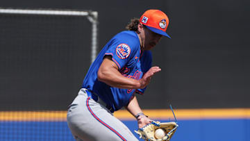 Feb 13, 2025; Port St. Lucie, FL, USA; New York Mets pitcher Brandon Sproat (91) catches a line drive during live batting practice at Spring Training. Mandatory Credit: Jim Rassol-Imagn Images