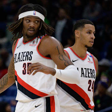 Jan 8, 2025; New Orleans, Louisiana, USA; Portland Trail Blazers guard Anfernee Simons (1) and center Robert Williams III (35) celebrate next to forward Kris Murray (24) during the first half against the New Orleans Pelicans at Smoothie King Center. Mandatory Credit: Matthew Hinton-Imagn Images