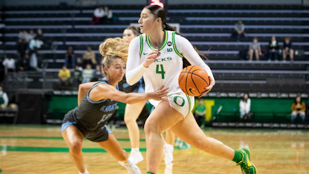 Oregon guard Nani Falatea presses toward the basket as the Oregon Ducks host the Warner Pacific Knights in an exhibition game