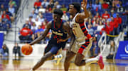 Nov 12, 2024; Oxford, Mississippi, USA; South Alabama Jaguars forward Barry Dunning Jr. (22) drives to the basket as Mississippi Rebels guard Davon Barnes (7) defends during the second half at C.M. 'Tad' Smith Coliseum. Mandatory Credit: Petre Thomas-Imagn Images